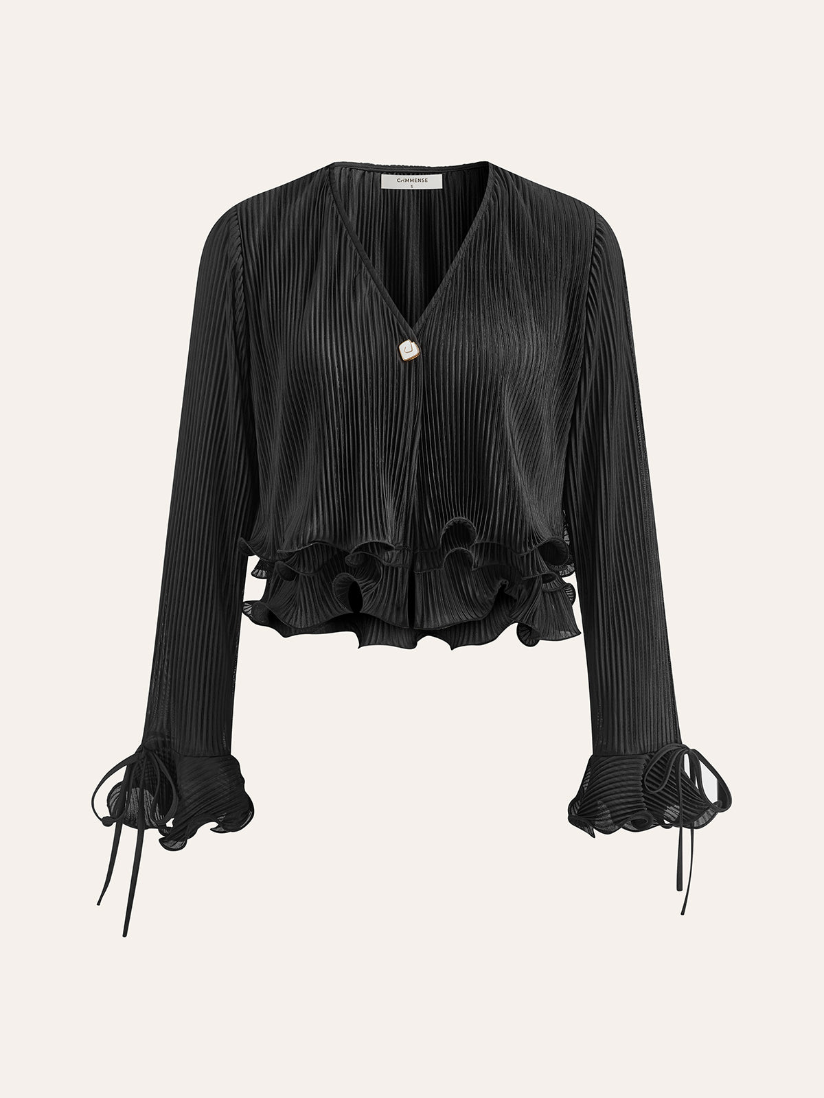 Plisserad blus med volangknappar