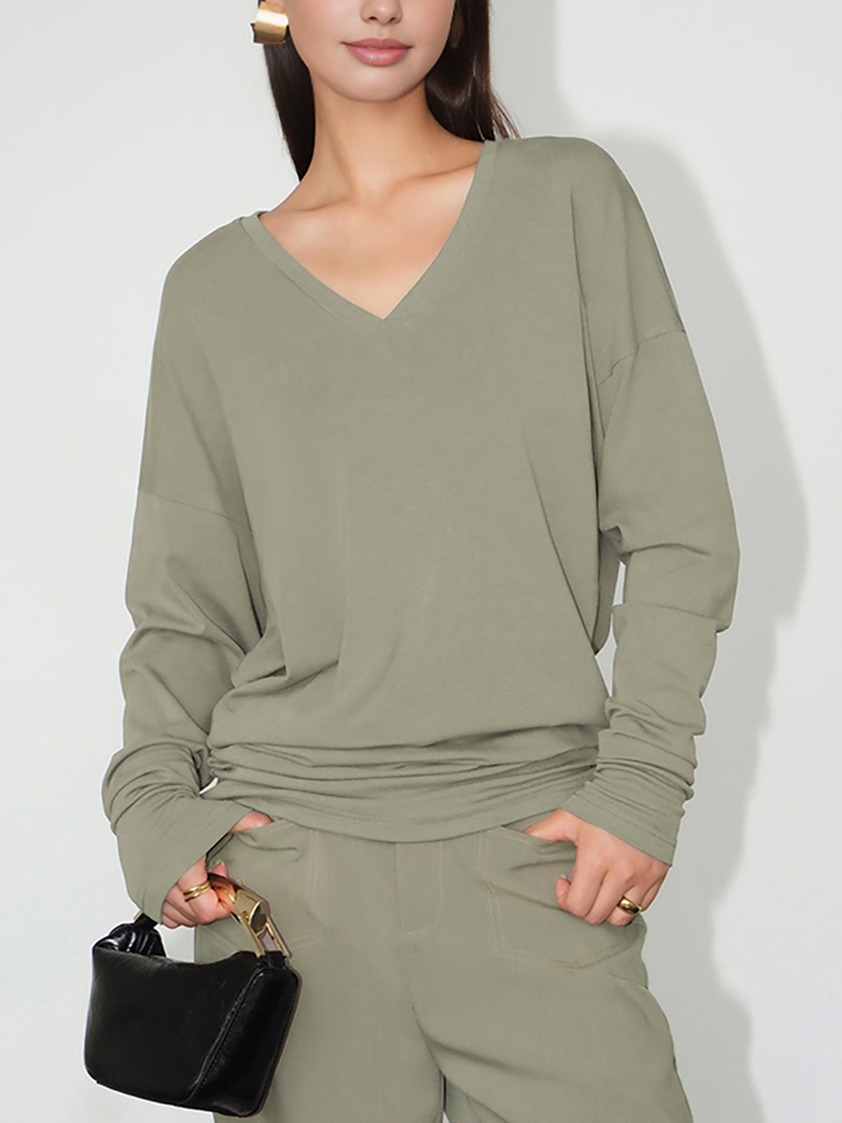 Minimalistisk V-ringad draperad topp 