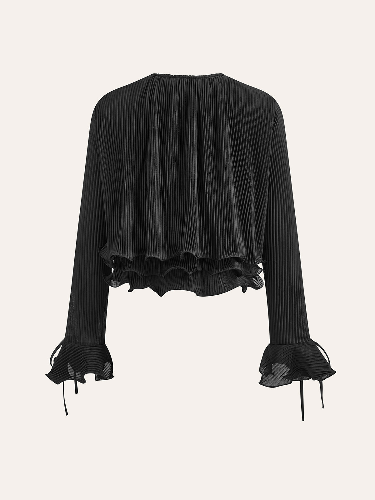 Plisserad blus med volangknappar 